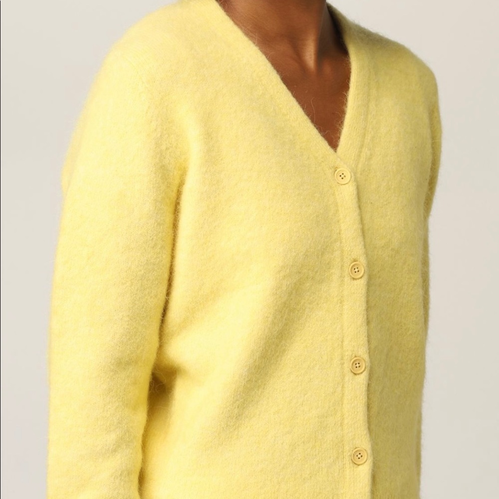 Calvin Klein x Heron Preston collaboration yellow cardigan.